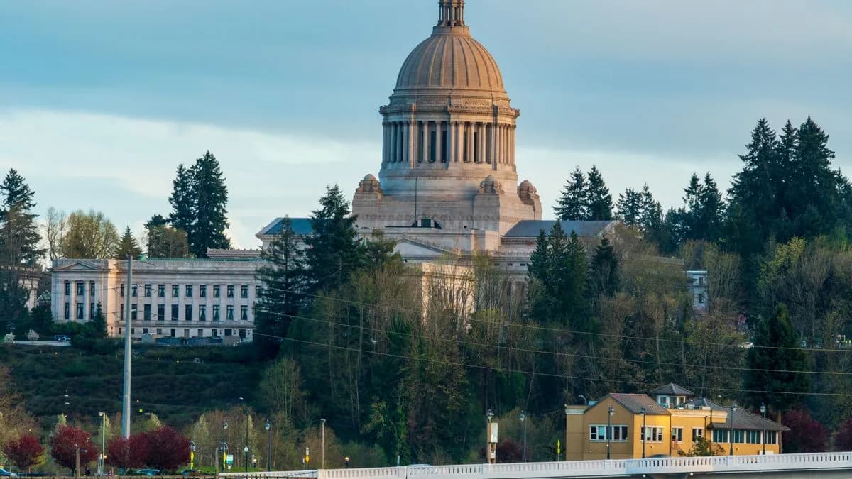 The Washington State Capitol dome in Olympia above the evergreens